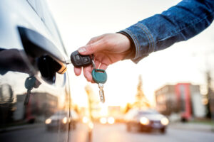 A man inserts his car keys into the door, getting ready to drive to the Mexican border. A DUI lawyer in Los Angeles can help you determine if you can cross the Mexican border if you have a DUI.