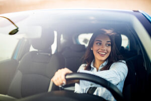 A woman in her car wonders, “what is an interlock device and how does it work in the state of California?”