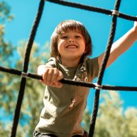 A child playing on playground equipment. A lawyer can explain how a DUI affects child custody in California. 