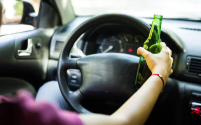 A woman driving DUI while in a rental car. The consequences of DUI in a rental car are extremely damaging to your health and life.